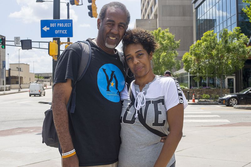 08/20/2019 -- Atlanta, Georgia -- Kimberly Carlisle (right) and Rodney Daniel (left) talk about their experiences riding shareable e-scooters near Centennial Olympic in Atlanta, Tuesday, August 20, 2019. Kimberly says she suffered physical injuries after she fell off an e-scooter. (Alyssa Pointer/alyssa.pointer@ajc.com)