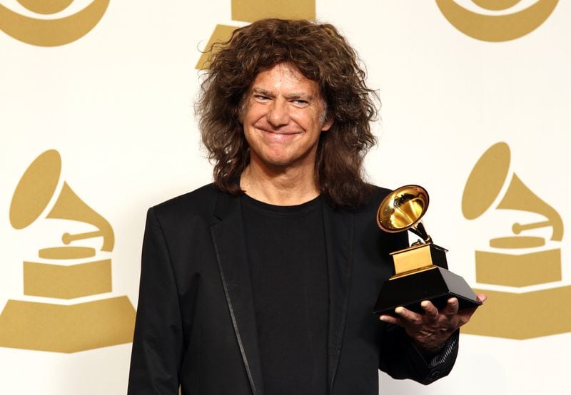 Pat Metheny poses backstage with the jazz instrumental album award for "Unity Band" backstage at the 55th annual Grammy Awards on Sunday, Feb. 10, 2013, in Los Angeles. (Photo by Matt Sayles/Invision/AP)