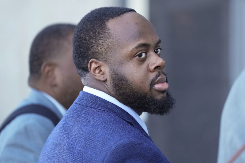 Tadarrius Bean, one of three former Memphis police officers charged in the 2023 fatal beating of Tyre Nichols, arrives at the federal courthouse for the day's proceedings Thursday, Oct. 3, 2024, in Memphis, Tenn. (AP Photo/George Walker IV)