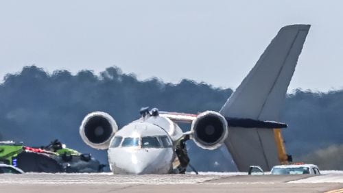 A Delta Air Lines aircraft hit the tail of another Delta plane at Hartsfield-Jackson International Airport on Tuesday morning. (John Spink/AJC)