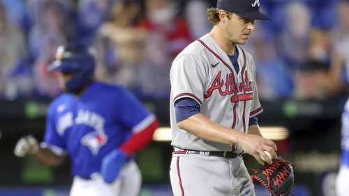 Atlanta Braves relief pitcher Jacob Webb reacts after giving up a three-run home run to Toronto Blue Jays' Teoscar Hernandez during the sixth inning of a baseball game Friday, April 30, 2021, in Dunedin, Fla. (AP Photo/Mike Carlson)