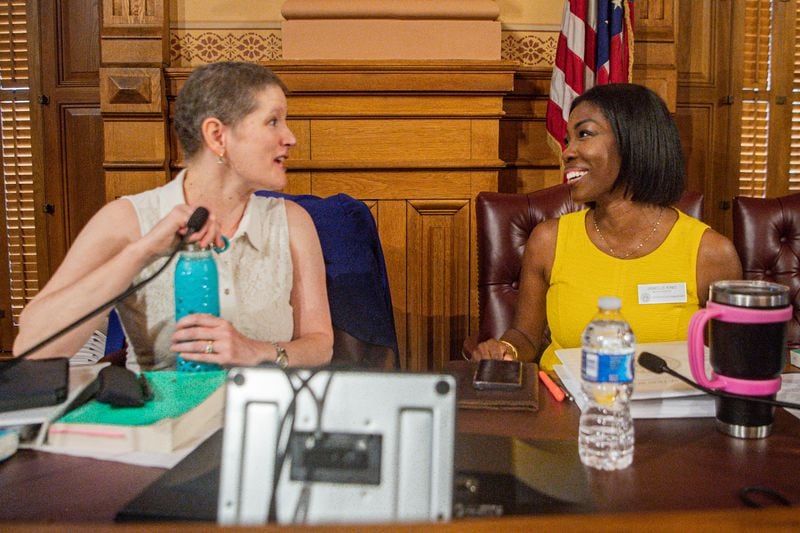 State Election Board members Sara Tindall Ghazal (left) and Janelle King speak during a State Election Board meeting in Atlanta on July 9, 2024. (Ziyu Julian Zhu/AJC)