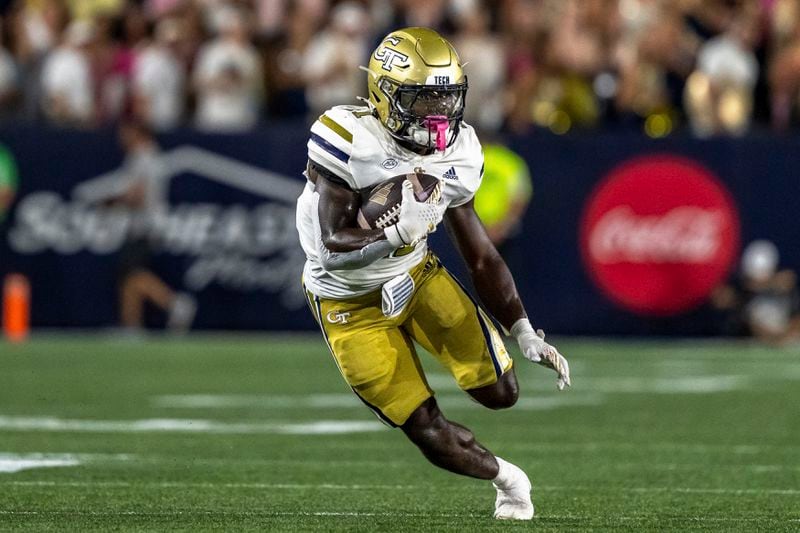 Georgia Tech Yellow Jackets running back Jamal Haynes (11) runs the ball in the first quarter of a football game against the Duke BlueDevils, Saturday, Oct. 5, 2024, in Atlanta. (AP Photo/Jason Allen)