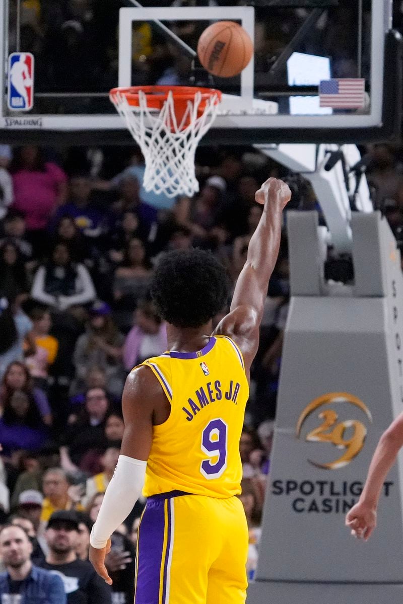 Los Angeles Lakers guard Bronny James shoots and misses during the first half of a preseason NBA basketball game against the Minnesota Timberwolves, Friday, Oct. 4, 2024, in Palm Desert, Calif. (AP Photo/Mark J. Terrill)