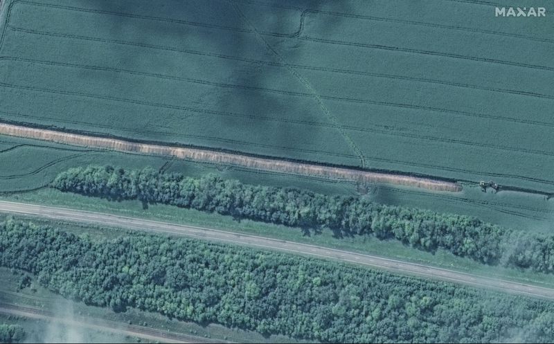 This image released by Maxar Technologies shows a trench being built southeast of Lgov, west of Kursk, Russia, Monday Aug. 12, 2024. (Satellite image ©2024 Maxar Technologies via AP)