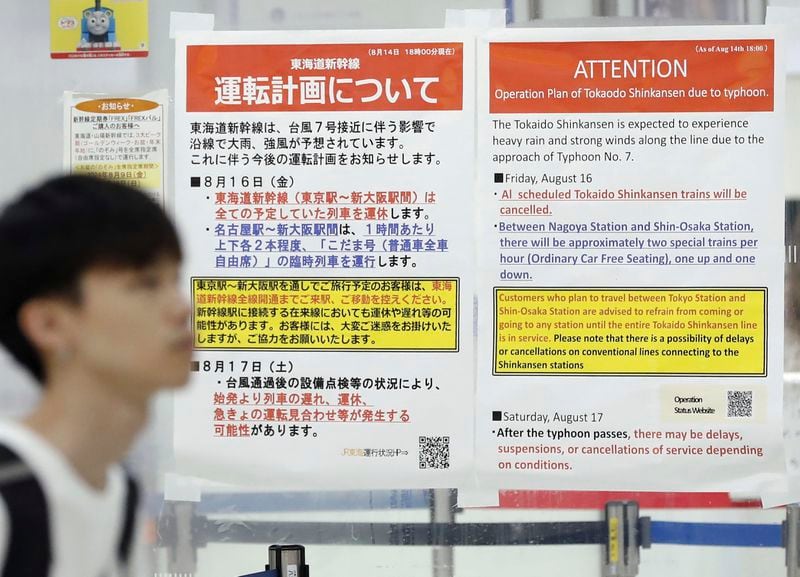 Station posters show the cancellation of Shinkansen bullet train services due to an approaching typhoon, at JR Tokyo station in Tokyo, Japan, Friday, Aug. 16, 2024. (Kyodo News via AP)