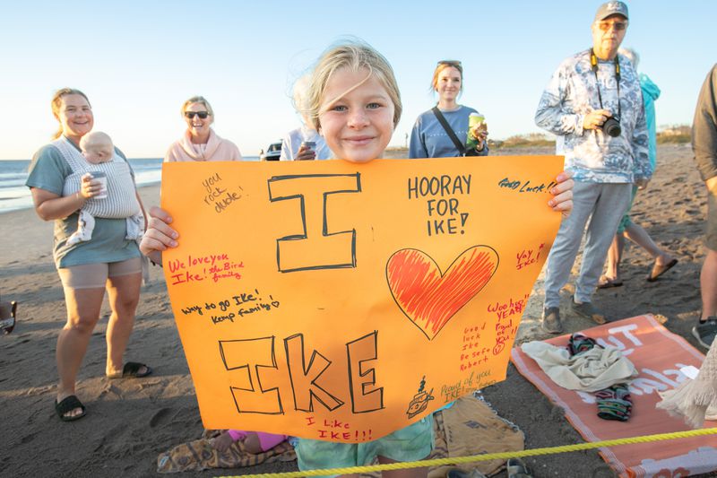 Fans of Ike made signs of support to show their love and appreciation of the sea turtle that has been at the Tybee Island Marine Science Center for the last three years. (Casey Jones for the Savannah Morning News)