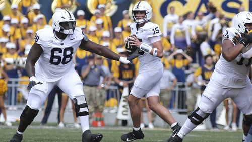 Penn State quarterback Drew Allar (15) looks to pass during the first half of an NCAA college football game against West Virginia in Morgantown, W.Va., Saturday, Aug. 31, 2024. (AP Photo/Kathleen Batten)