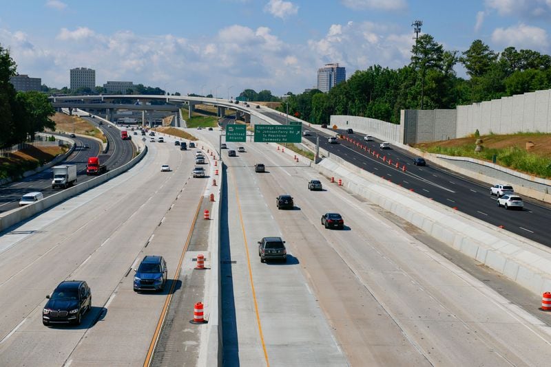 Cars and trucks travel in all the lines at Ga. 400 on Monday, June 24, 2024. (Miguel Martinez / AJC)