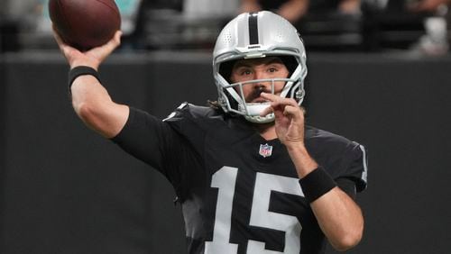 Las Vegas Raiders quarterback Gardner Minshew (15) warms up before an NFL preseason football game against the Dallas Cowboys, Saturday, Aug. 17, 2024, in Las Vegas. (AP Photo/Rick Scuteri)