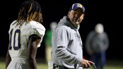 Nov. 20, 2020 - Buford, Ga: Dacula coach Clint Jenkins, right, talks with defensive back Ulysses Jenkins (10) after Buford scored a touchdown against them in the first half at Buford high school Friday, November 20, 2020 in Buford, Ga..  JASON GETZ FOR THE ATLANTA JOURNAL-CONSTITUTION



