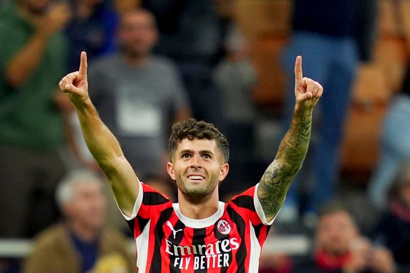 AC Milan's Christian Pulisic celebrates scoring his side's opening goal during the Champions League opening phase soccer match between AC Milan and Liverpool at the San Siro stadium in Milan, Italy, Tuesday, Sept. 17, 2024. (Spada/LaPresse via AP)