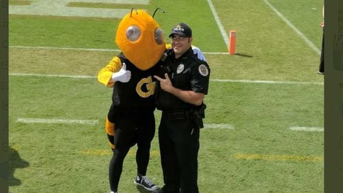 Georgia Tech police officer James Cornacchia, pictured right, died Monday from COVID-19, school officials said. He served for nearly 20 years. PHOTO CONTRIBUTED.