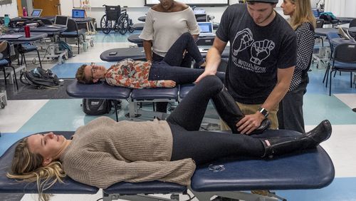 Students in Georgia State University's occupational therapy master's program work on restoring functions to help patients return to normal activities.