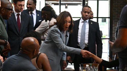 Vice President Kamala Harris makes a brief stop at Paschal's restaurant as she heads to a rally Tuesday at Georgia State University’s Convocation Center in Atlanta. It was her first campaign event in Georgia since she became the presumptive Democratic nominee for president.  (Hyosub Shin / Hyosub.Shin / ajc.com)