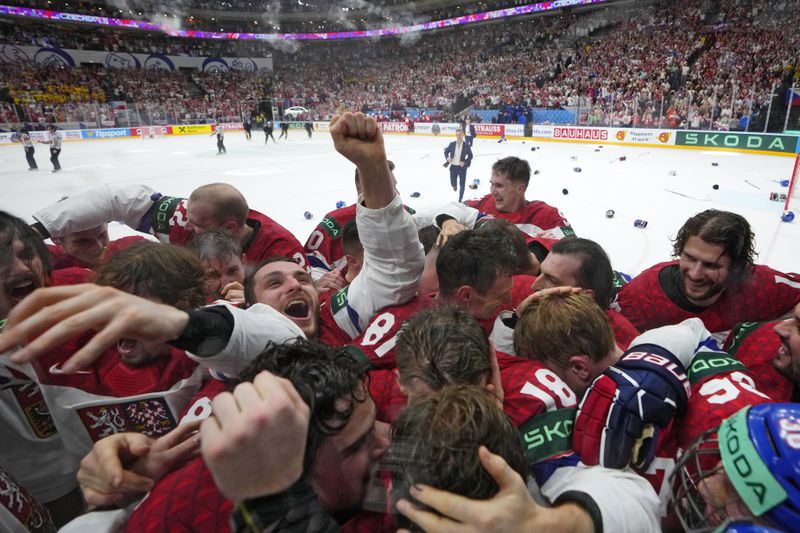 Members of the Czech Republic team celebrates after they defeated Switzerland 2-0 in a gold medal match at the Ice Hockey World Championships in Prague, Czech Republic, Sunday, May 26, 2024. (AP Photo/Petr David Josek)