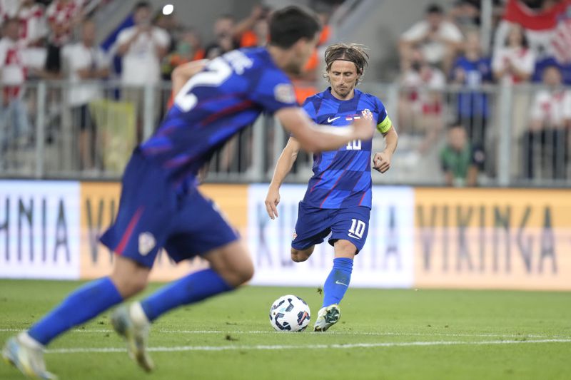 Croatia's Luka Modric scores his side's opening goal during the UEFA Nations League soccer match between Croatia and Poland at the Opus Arena in Osijek, Croatia, Sunday, Sept. 8, 2024. (AP Photo/Darko Bandic)