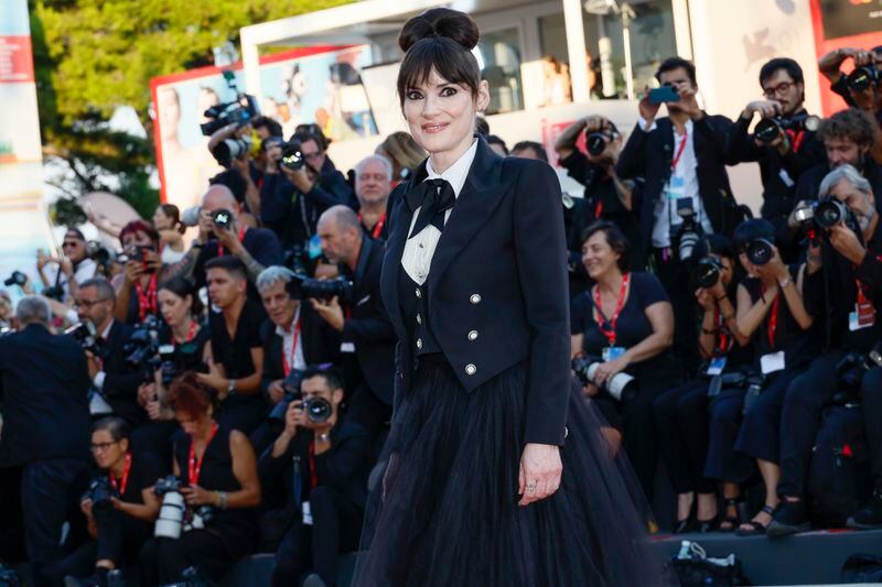 Winona Ryder poses for photographers upon arrival for the premiere of the film 'Beetlejuice Beetlejuice' and the opening ceremony of the 81st edition of the Venice Film Festival in Venice, Italy, on Wednesday, Aug. 28, 2024. (Photo by Joel C Ryan/Invision/AP)