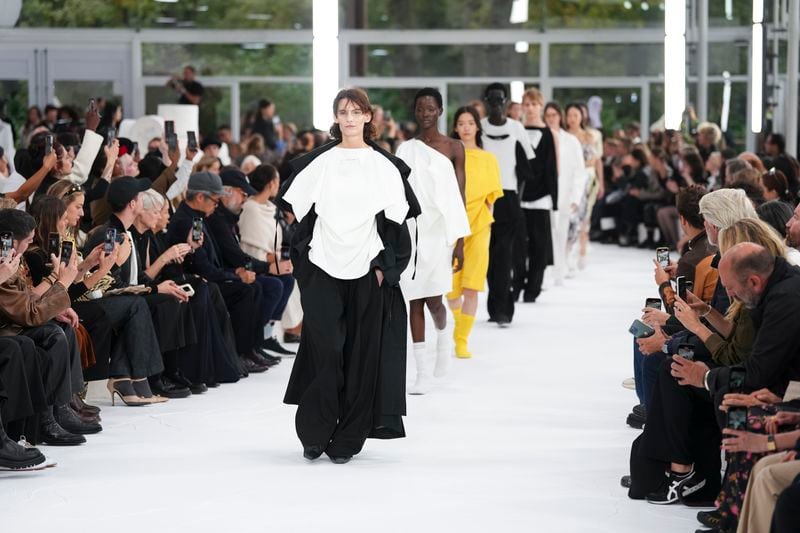 Models wear creations as part of the Issey Miyake Spring/Summer 2025 collection presented Friday, Sept. 27, 2024 in Paris. (Photo by Scott A Garfitt/Invision/AP)