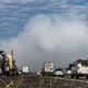 The smoke cloud from a chemical plant fire drifts across I-20 in Conyers Thursday morning. John Spink/ AJC