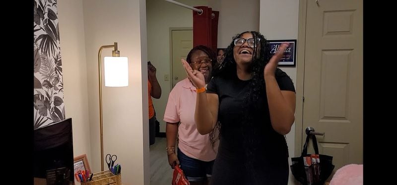 A Savannah State University student is overwhelmed by her dorm room reveal by Move-In Mafia. Courtesy of TeeJ Mercer