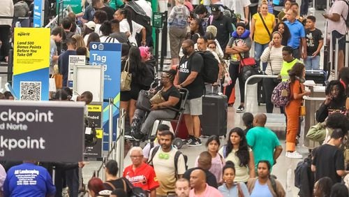 Passengers fill the domestic terminal at Hartsfield-Jackson International Airport on July 23 in Atlanta, on the fifth day of a massive global technology outage that has severely impacted the operations of Delta Air Lines. (John Spink/The Atlanta Journal-Constitution)