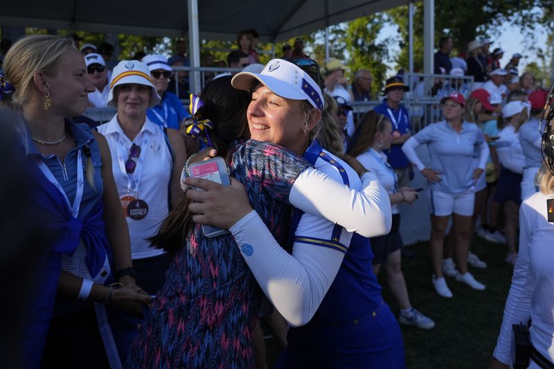 Europe's Emily Pedersen celebrates winning a fourball match during a Solheim Cup golf tournament at Robert Trent Jones Golf Club, Saturday, Sept. 14, 2024, in Gainesville, Va. (AP Photo/Chris Szagola)