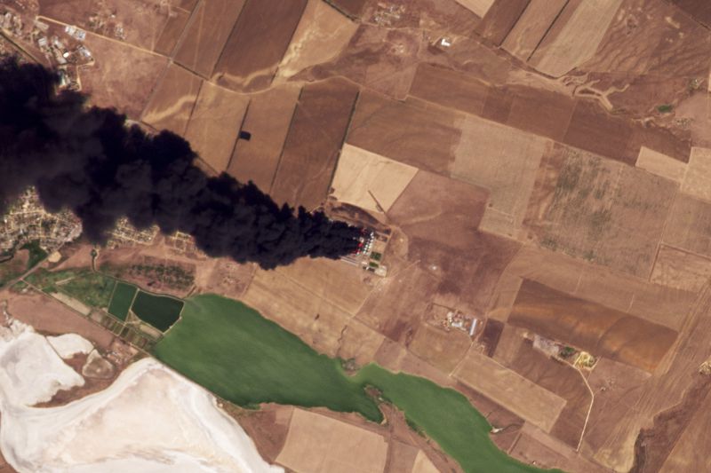 This satellite photo from Planet Labs PBC shows a fire at an oil depot earlier hit by a Ukrainian drone attack near Proletarsk, Russia, Wednesday, Aug. 21, 2024. (Planet Labs PBC via AP)