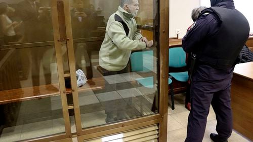 In this photo released by the Moscow City Court Press Service, Stephen Hubbard, a U.S. citizen accused of fighting as a mercenary in Ukraine against Russia stands in a glass cage during a court session in the Moscow City court in Moscow, Russia, Monday, Oct. 7, 2024. (Moscow City Court Press Service via AP)