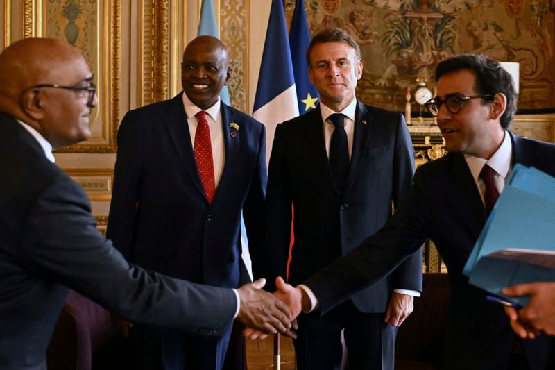 French President Emmanuel Macron, second right, and French Minister for Foreign and European Affairs Stephane Sejourne, right, attend a meeting with Botswana's President Mokgweetsi Eric Keabetswe Masisi during the African Vaccine Manufacturing Accelerator conference, Thursday, June 20, 2024 in Paris. French President Emmanuel Macron is joining some African leaders to kick off a planned $1 billion project to accelerate the rollout of vaccines in Africa, after the coronavirus pandemic bared gaping inequalities in access to them. (Dylan Martinez/Pool via AP)