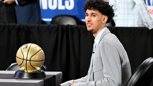 Zaccharie Risacher sits on his table ahead of the first round of the 2024 NBA Draft at Barclays Arena on Wednesday, June 26, 2024 in Brooklyn, NY. (Hyosub Shin / AJC)