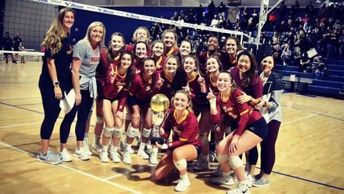 Holy Innocents Volleyball team celebrates after winning a Georgia State Championship. They played 30-plus matches in 2020, with all teams following the COVID protocol.