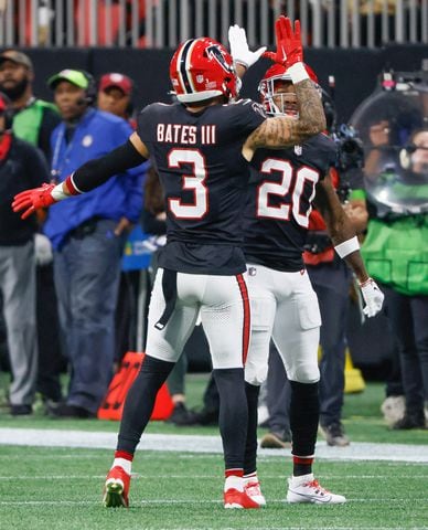 Atlanta Falcons safety Jessie Bates III (3) and Dee Alford (20) celebrate a pass break up on 2nd and 20 during the first half of an NFL football game against the New Orleans Saints in Atlanta on Sunday, Nov. 26, 2023.   (Bob Andres for the Atlanta Journal Constitution)