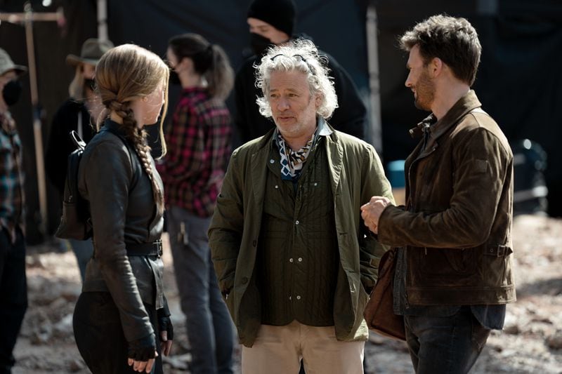 Director Dexter Fletcher (center) with stars Ana de Armas and Chris Evans of "Ghosted." APPLE TV+