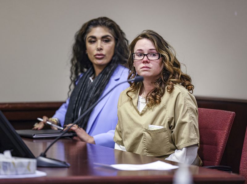 Hannah Gutierrez-Reed, the weapons supervisor on the set of the Western film “Rust," right, sits beside paralegal Carmella Sisneros at the start of her plea hearing at the First Judicial District Courthouse in Santa Fe, N.M., Monday, Oct. 7, 2024. (Gabriela Campos/Santa Fe New Mexican via AP, Pool)