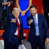 Former president Donald Trump, with running mate JD Vance at right, gestures to supporters at Fiserv Forum, where the Republican National Convention is being held in Milwaukee on Monday, July 15, 2024. (Arvin Temkar / AJC)