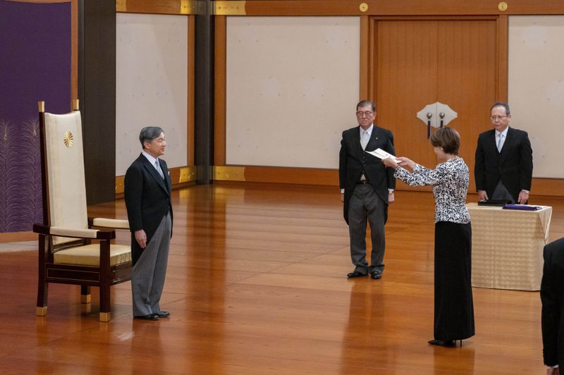 In this photo provided by Japan's Imperial Household Agency of Japan, Japan's Emperor Naruhito, left, stands before Junko Mihara, second right, newly appointed minister in charge of Policies Related to Children, as new Prime Minister Shigeru Ishiba, second left, looks on during the attestation ceremony at the Imperial Palace in Tokyo, Tuesday, Oct. 1, 2024. (Imperial Household Agency of Japan via AP)