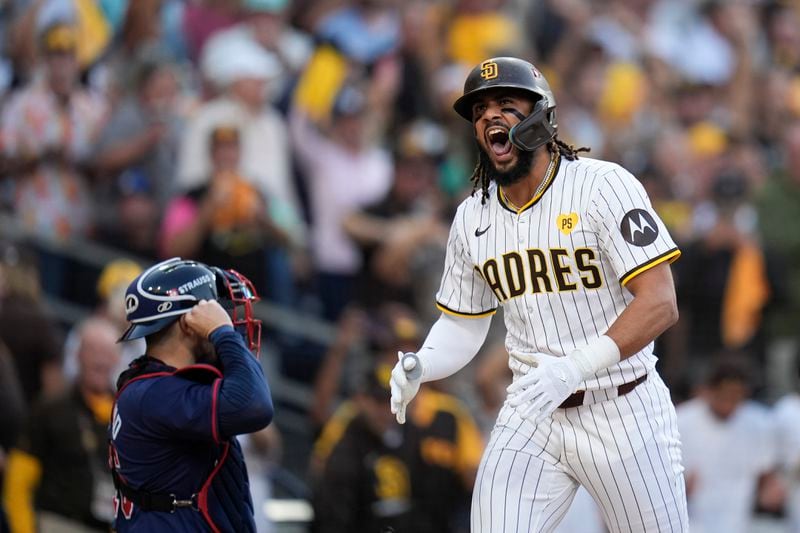 San Diego Padres' Fernando Tatis Jr. reacts after connecting for a two-run home run during the first inning in Game 1 of an NL Wild Card Series baseball game against the Atlanta Braves, Tuesday, Oct. 1, 2024, in San Diego. (AP Photo/Gregory Bull)