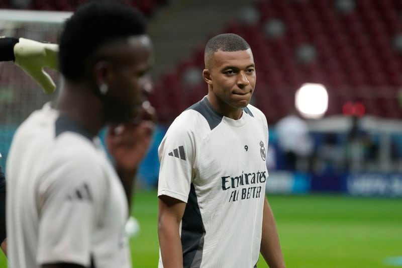 Real Madrid's Kylian Mbappe attends a training session ahead of the UEFA Super Cup Final soccer match between Real Madrid and Atalanta at the Narodowy stadium in Warsaw, Poland, Tuesday, Aug. 13, 2024. (AP Photo/Czarek Sokolowski)