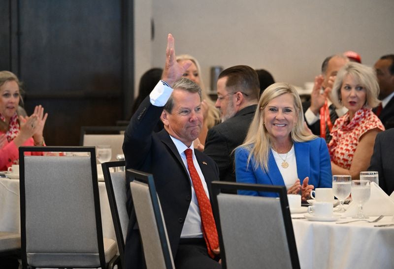 Gov. Brian Kemp is honored as he sits with First Lady Marty Kemp during the second day of the Georgia Delegation Breakfast at Lake Lawn Resort in Delavan, Wis., Tuesday, July 16, 2024. (Hyosub Shin/AJC)