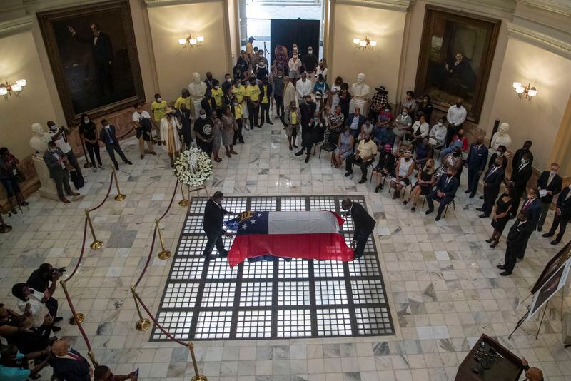 07/22/2020 - Atlanta, Georgia - The Georgia State flag is placed on the casket of C.T. Vivian as his body lie in state inside the rotunda at the Georgia State Capitol Building during a special service to honor his legacy in Atlanta, Wednesday, July 22, 2020.  (ALYSSA POINTER / ALYSSA.POINTER@AJC.COM)