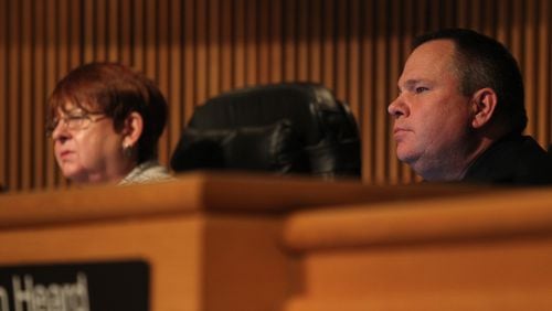 Gwinnett County Commissioner Tommy Hunter sits beside chairman Charlotte Nash during a Jan. 17 meeting. (HENRY TAYLOR / HENRY.TAYLOR@AJC.COM)