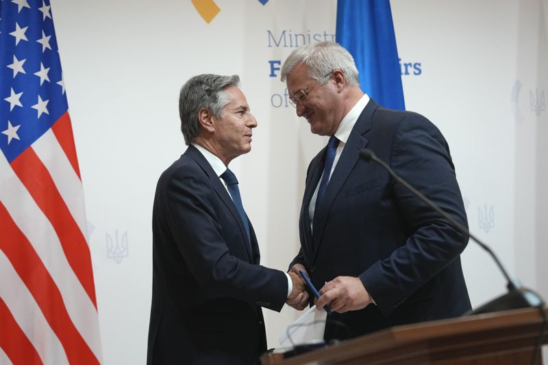 U.S. Secretary of State Antony Blinken, left, greets Ukraine's Foreign Minister Andriiy Sybiha at the end of a joint news conference with Britain's Foreign Secretary David Lammy at the Ministry of Foreign Affairs in Kyiv, Ukraine, Wednesday, Sept. 11, 2024. (AP Photo/Efrem Lukatsky)