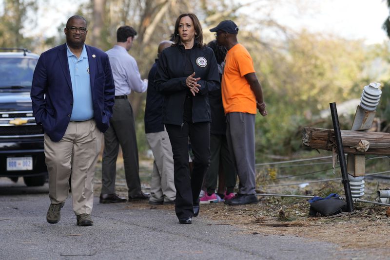 Democratic presidential nominee Vice President Kamala Harris walks with Augusta Mayor Garnett Johnson in Augusta, Ga., Wednesday, Oct. 2, 2024, as she visits areas impacted by Hurricane Helene. (AP Photo/Carolyn Kaster)