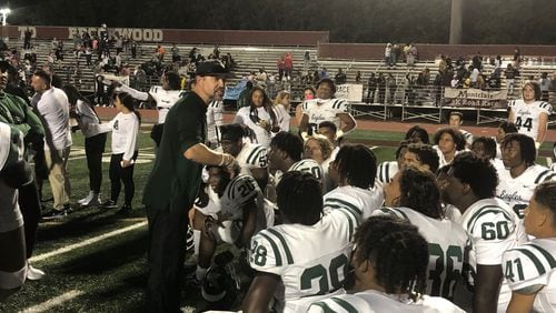 Collins Hill coach Drew Swick talks to his team after the 31-17 win over Brookwood on Sept. 1, 2023.