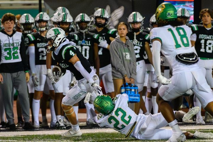 Roswell’s wide receiver, Grant Cook, runs the ball. (Jamie Spaar for the Atlanta Journal Constitution)