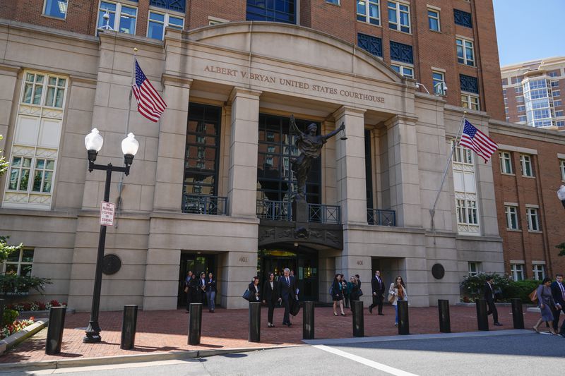 Lawyers leave the U.S. District Court for the Eastern District of Virginia for a lunch break in the Department of Justice's antitrust trial against tech giant Google, Monday, Sept. 9, 2024, in Alexandria, Va. One month after a judge declared Google's search engine an illegal monopoly, the tech giant faces another antitrust lawsuit that threatens to break up the company, this time over its advertising technology. (AP Photo/Stephanie Scarbrough)