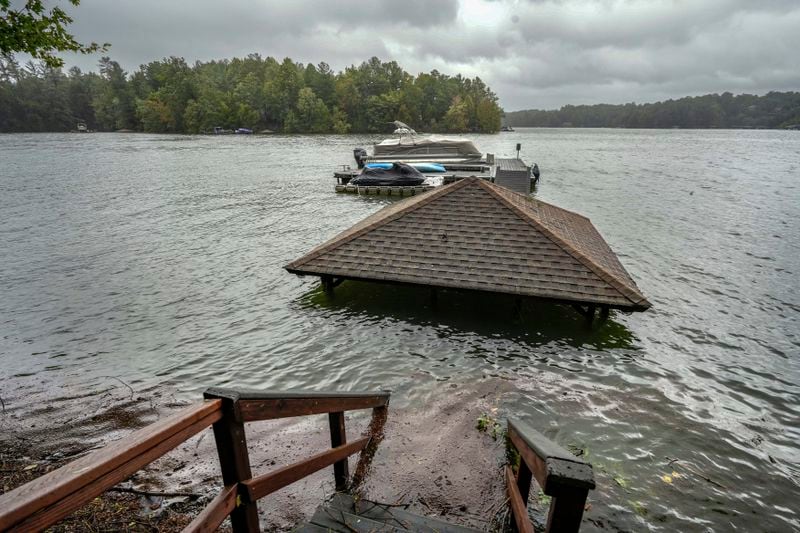 Torrential rain from Hurricane Helene has caused lake levels to rise on Lake James, resulting in flooded docks and gazebos, Friday, Sept. 27, 2024 in Morganton, N.C. (AP Photo/Kathy Kmonicek)