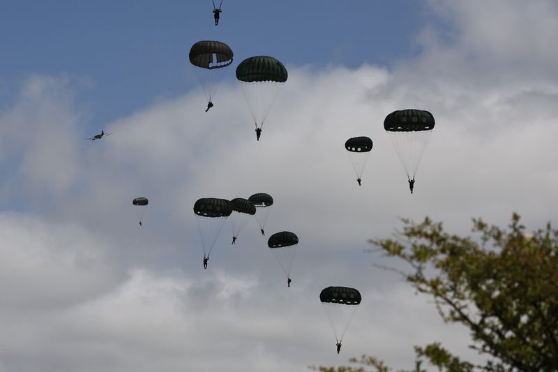 Parachute drop in Carentan-Les-Marais in Normandy, France on Sunday, June 02, 2024, ahead of D-Day 80th anniversary commemorations. (AP Photo/Jeremias Gonzalez)