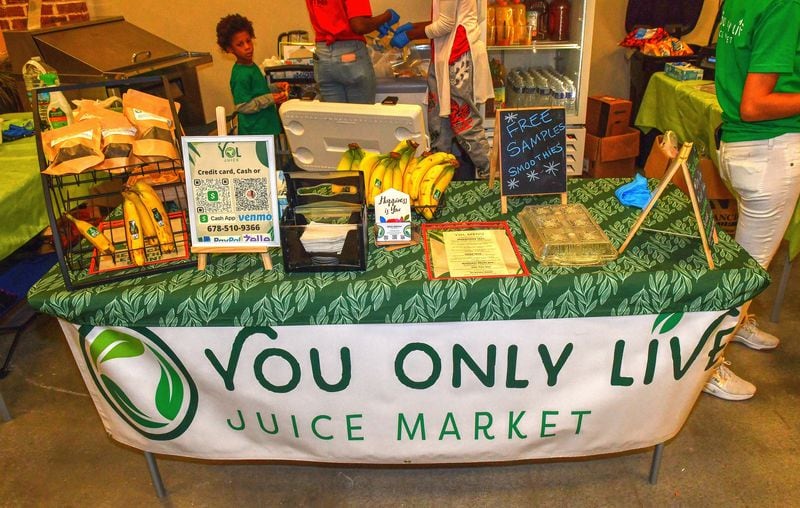 Samples of items that will be offered at the YOL Juice Market sit out for shoppers at the New Black Wall Street Market. (Chris Hunt for The Atlanta Journal-Constitution)
